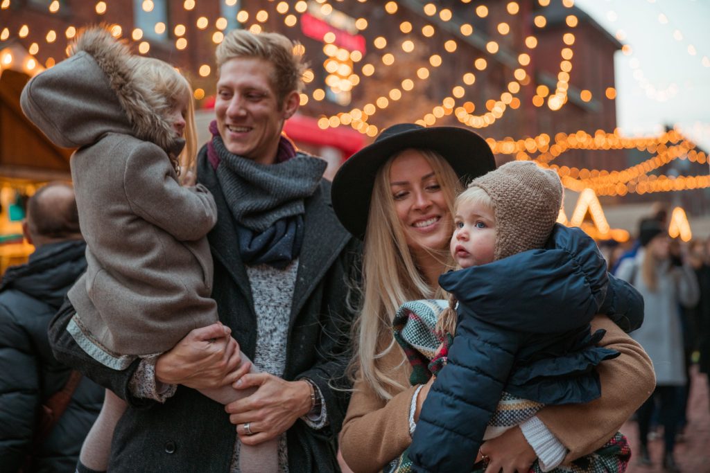 family-in-front-of-carousel